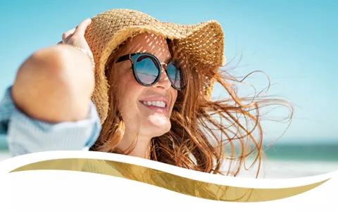 Photo of a woman enjoying her day at the beach